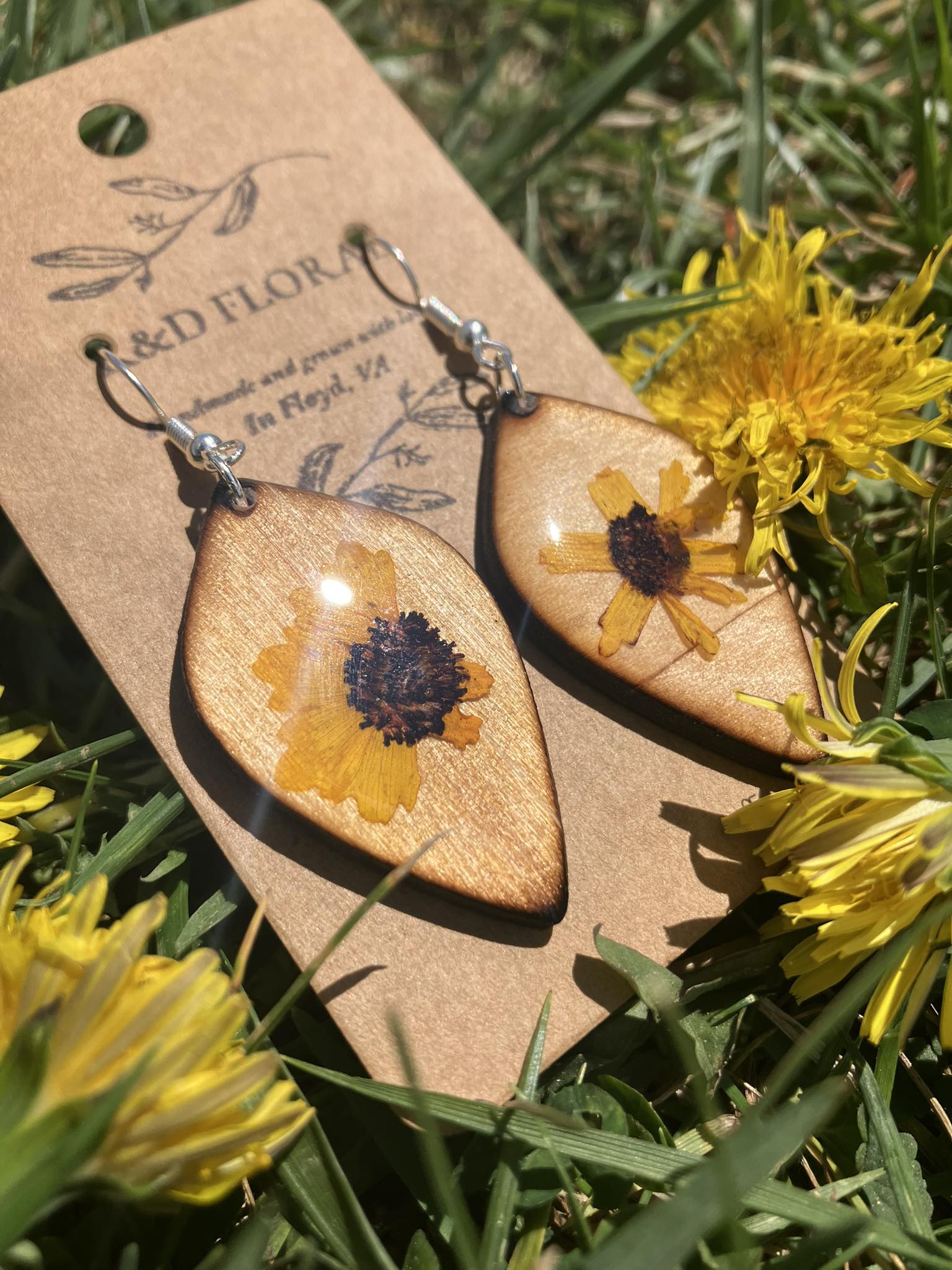 Wooden earrings with real Coreopsis flowers encased in resin, handmade by R & D Floral.